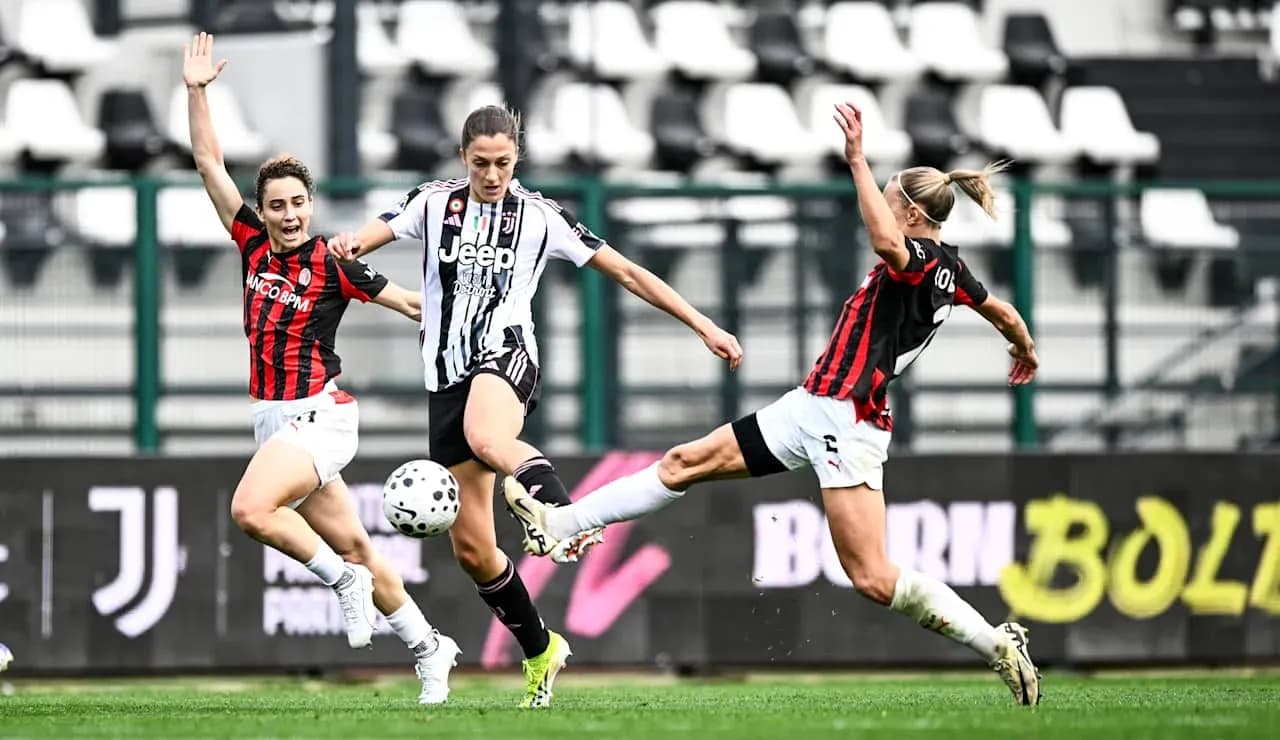 Juventus player dribbling past AC Milan defenders Juventus player dribbling past AC Milan defenders
