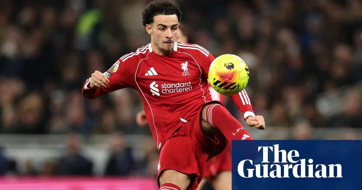 Liverpool player controlling the ball during match Liverpool player controlling the ball during match