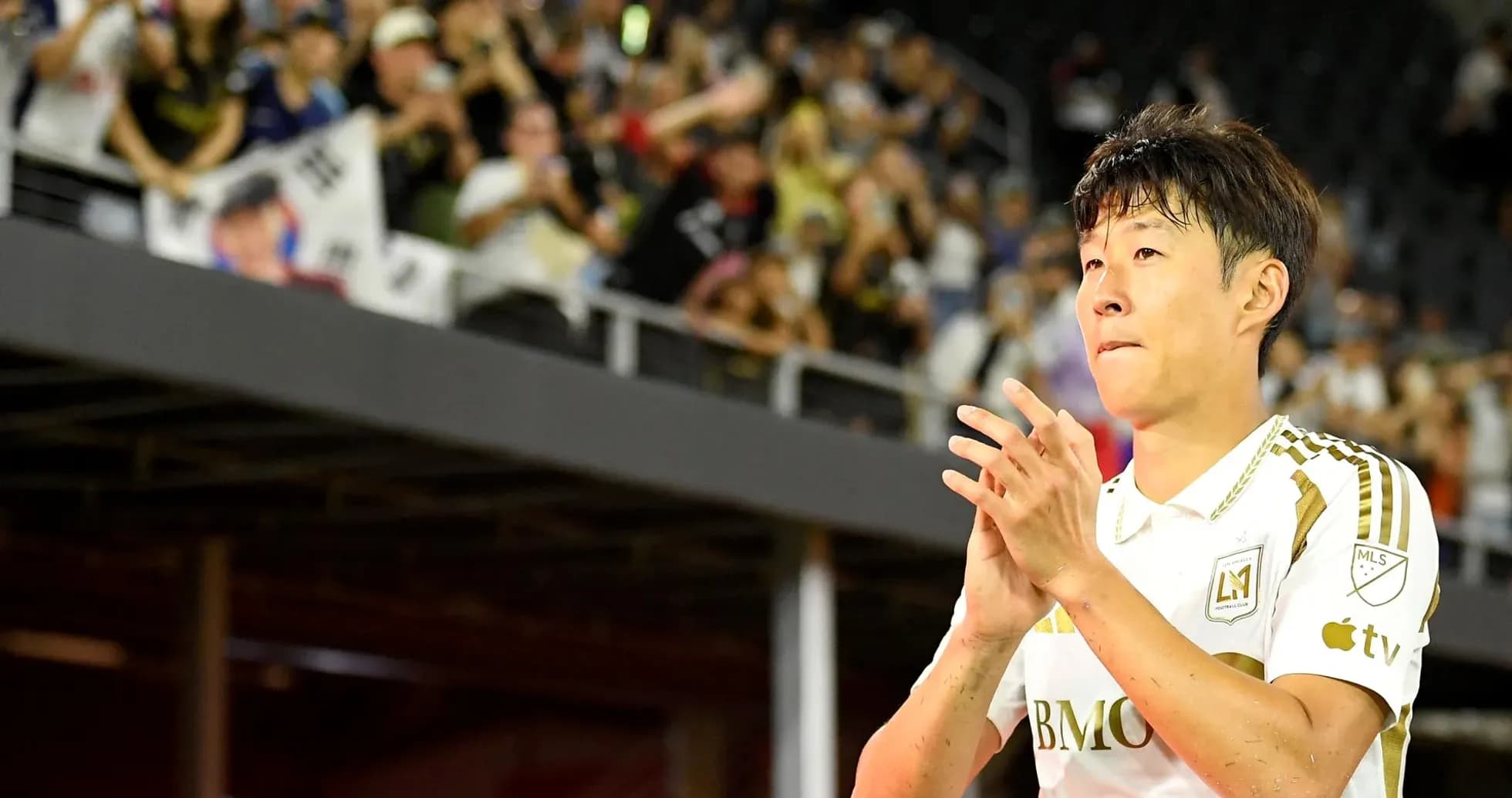 Player applauding fans after a match Player applauding fans after a match