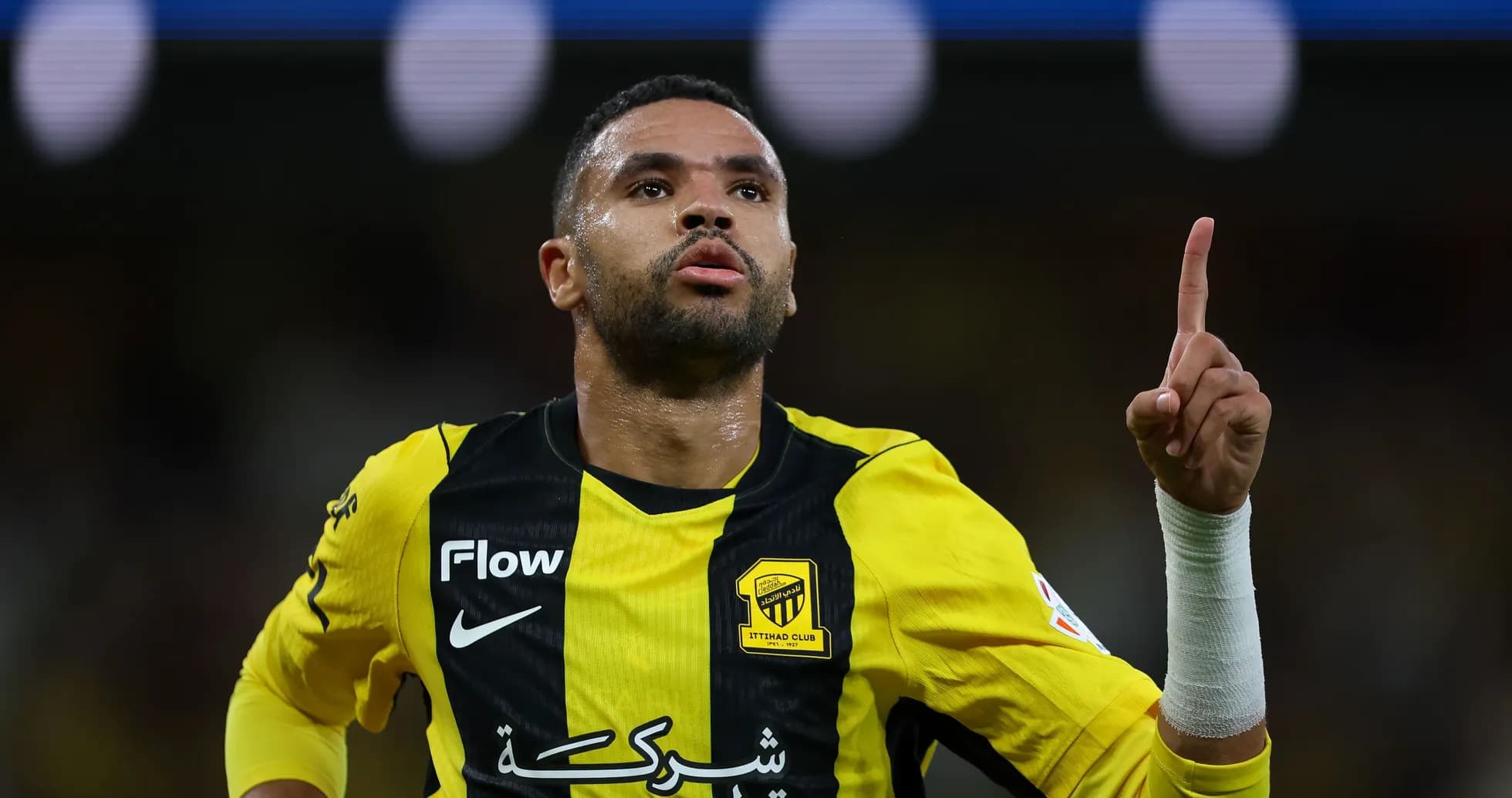 Player celebrating with raised finger after scoring Player celebrating with raised finger after scoring