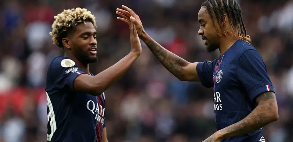 Two PSG players celebrating with a high five Two PSG players celebrating with a high five