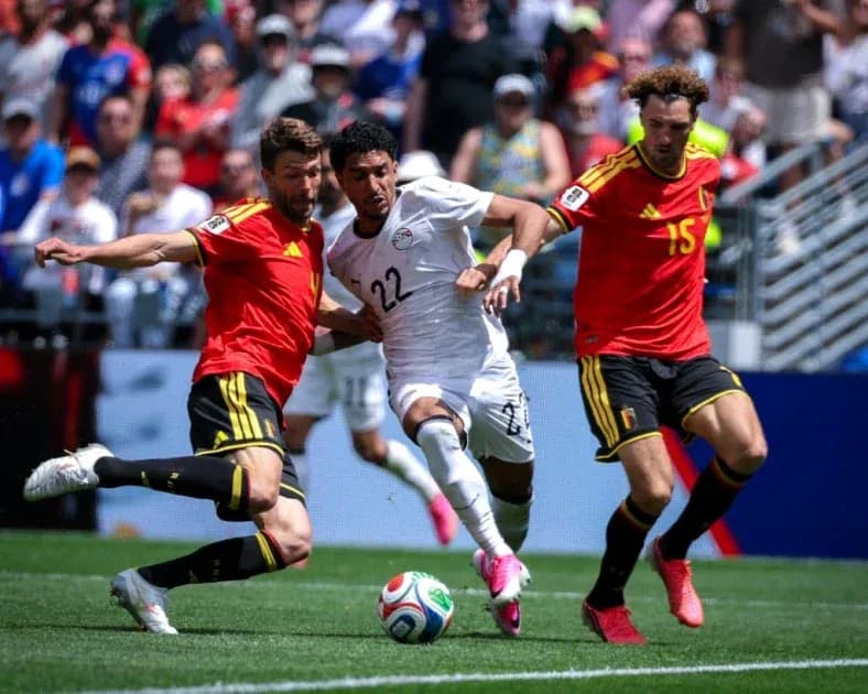 Two players from Belgium challenging an Egyptian player Two players from Belgium challenging an Egyptian player