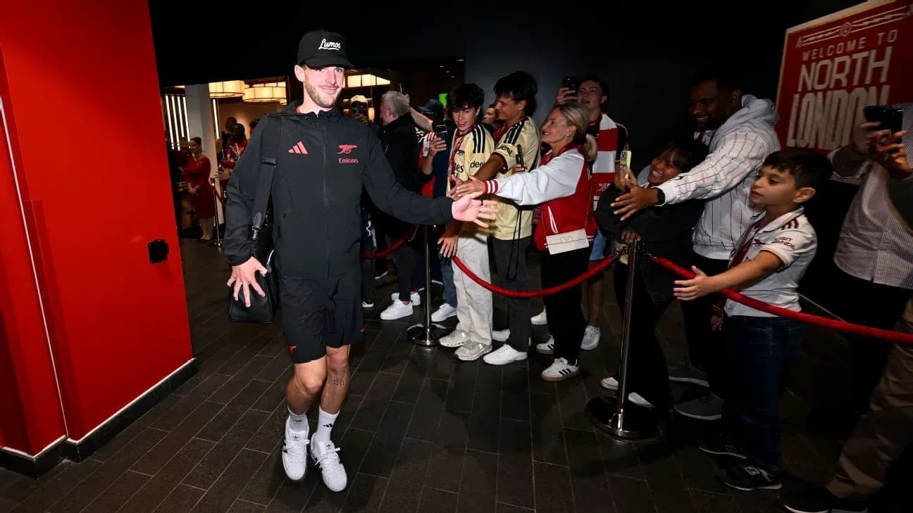 Player greeting fans upon arrival at venue Player greeting fans upon arrival at venue