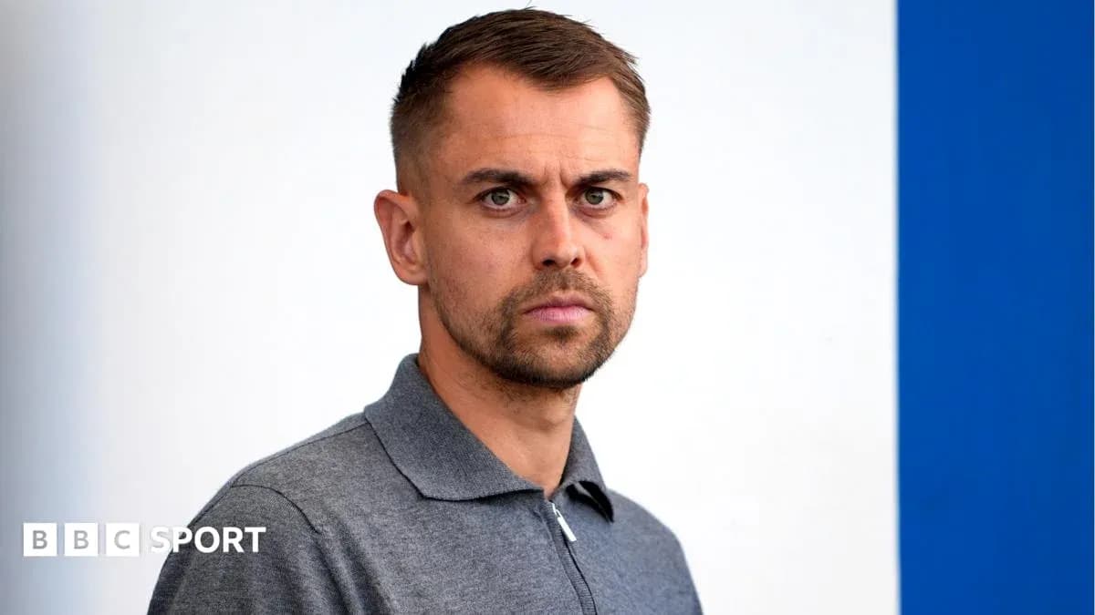 Man in gray polo shirt against blue background Man in gray polo shirt against blue background