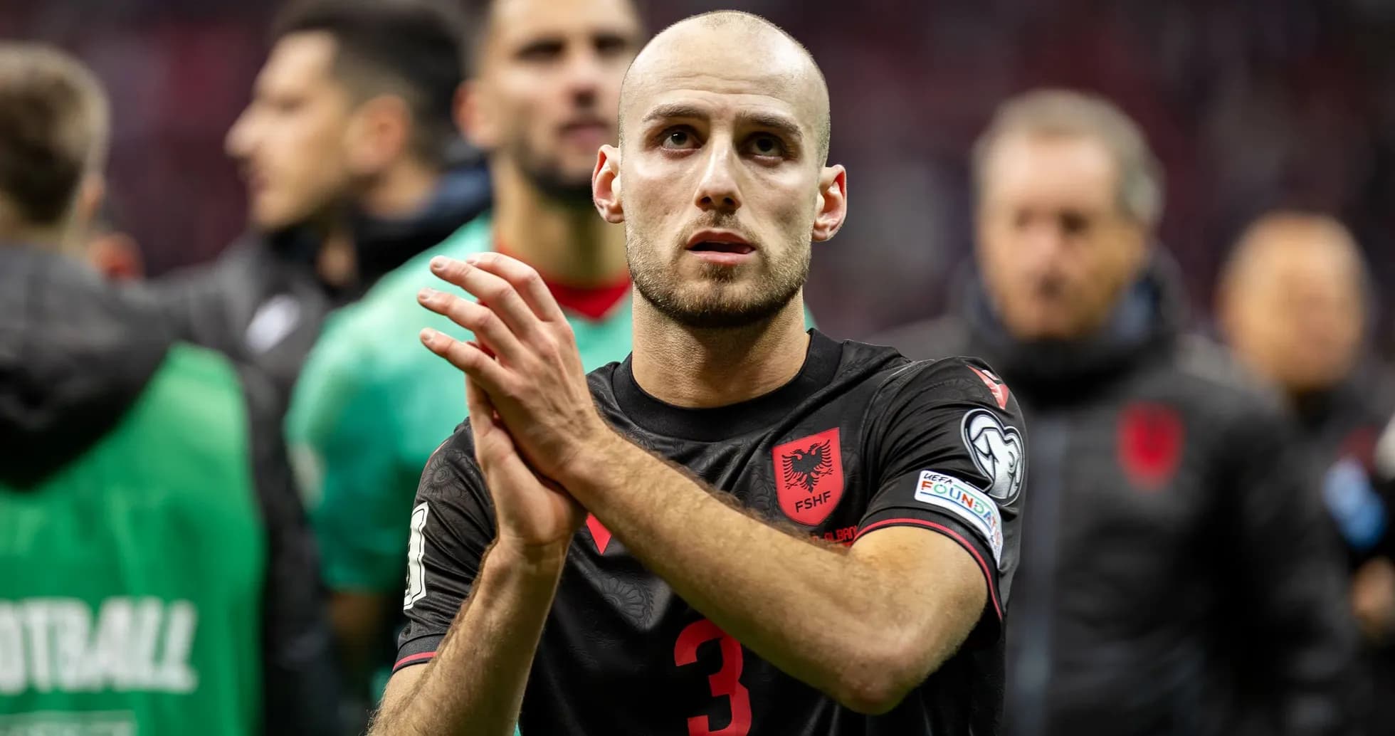 Player in black jersey applauding after match Player in black jersey applauding after match