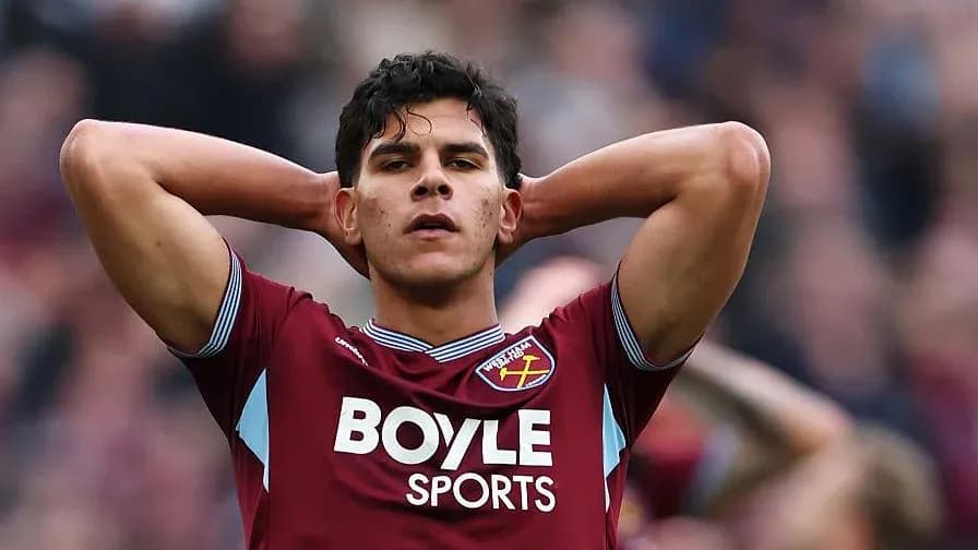 Player in West Ham jersey with hands on head Player in West Ham jersey with hands on head