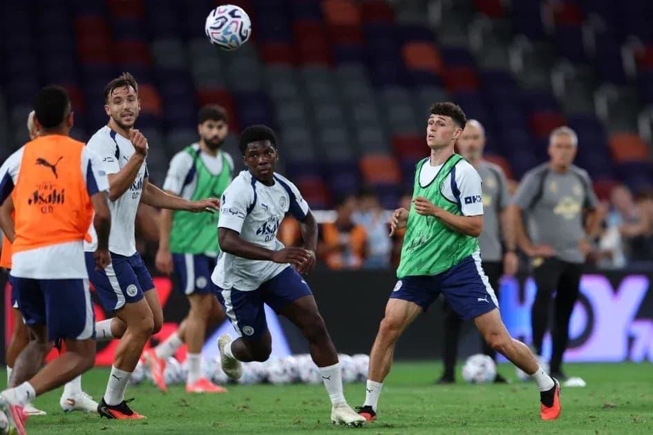 Players training and passing ball during practice session Players training and passing ball during practice session