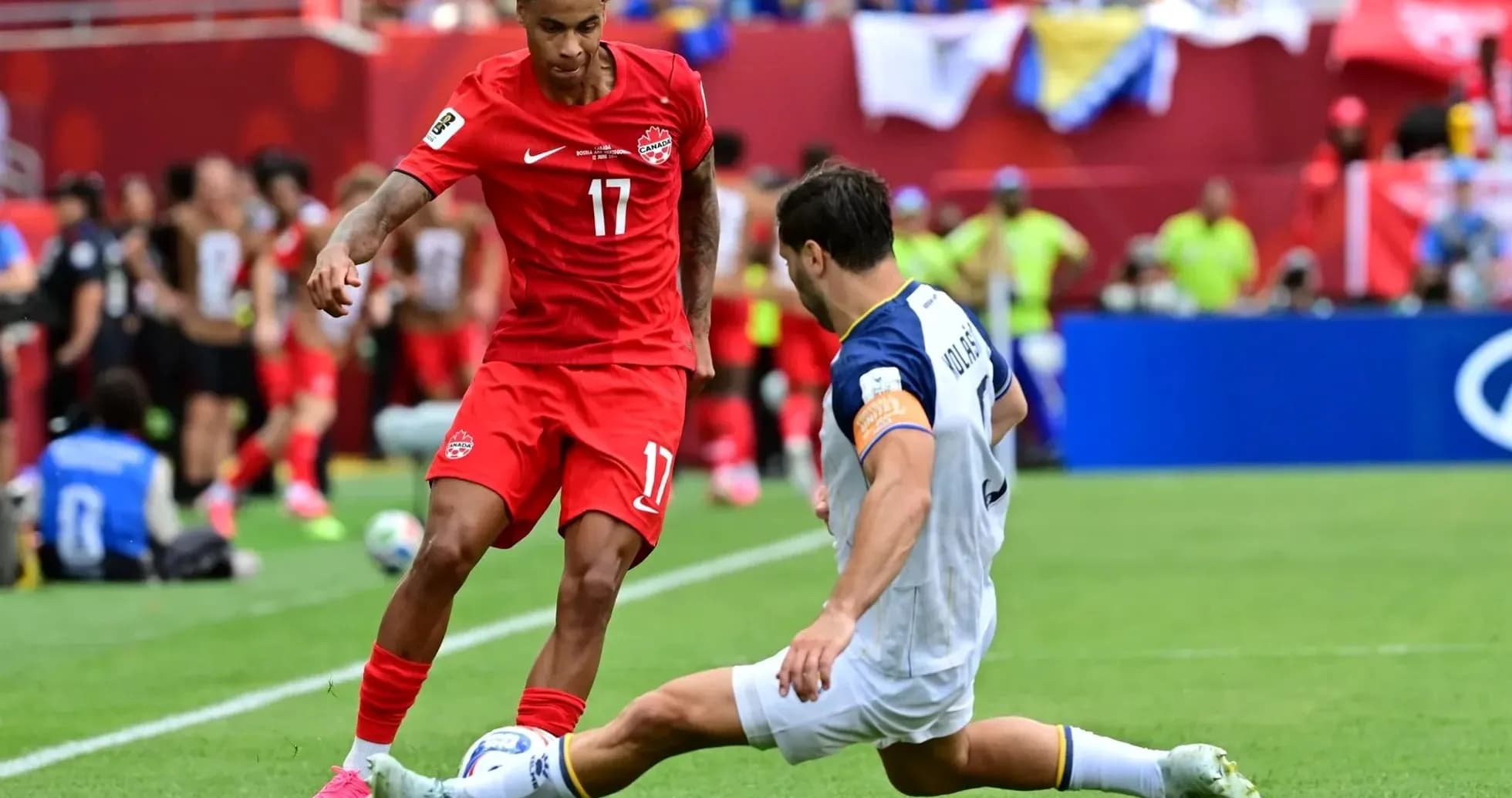 Canada player evading tackle during World Cup match Canada player evading tackle during World Cup match