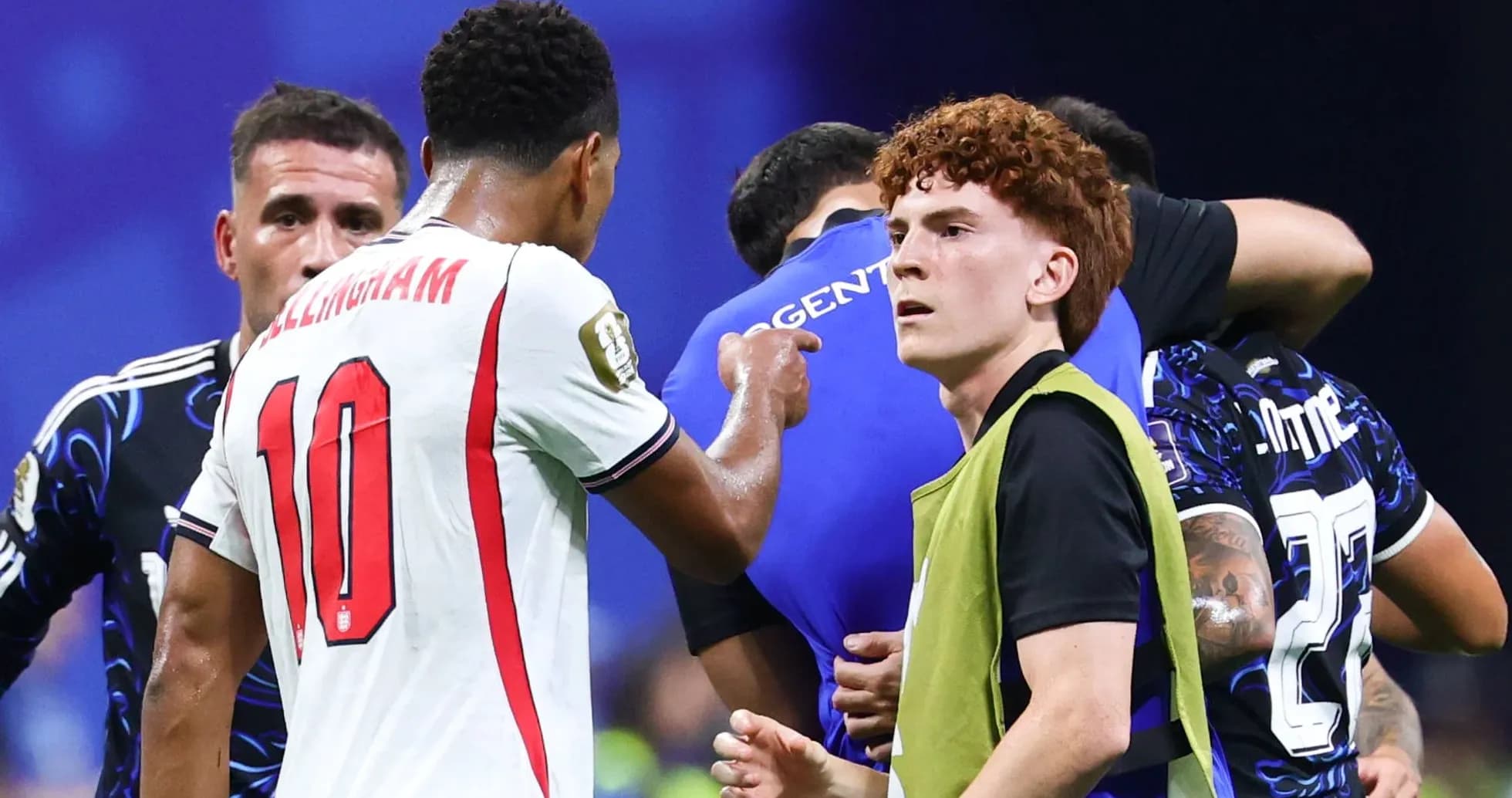Players interacting during a match, with substitutions occurring Players interacting during a match, with substitutions occurring