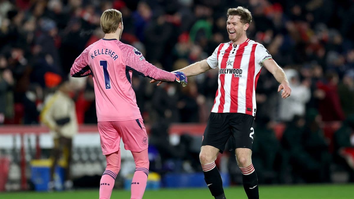 Goalkeeper and defender celebrating after match victory Goalkeeper and defender celebrating after match victory