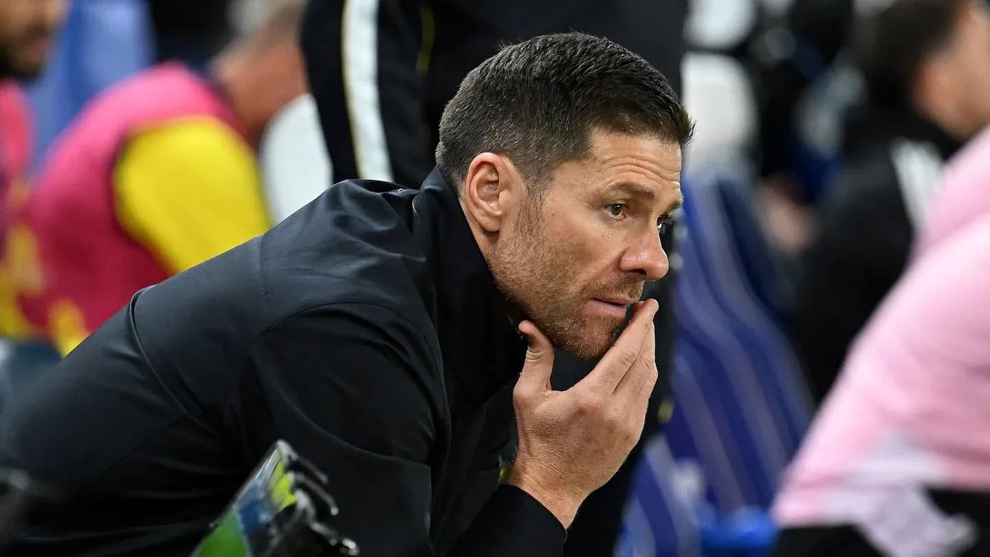 Coach deep in thought during match on sidelines Coach deep in thought during match on sidelines