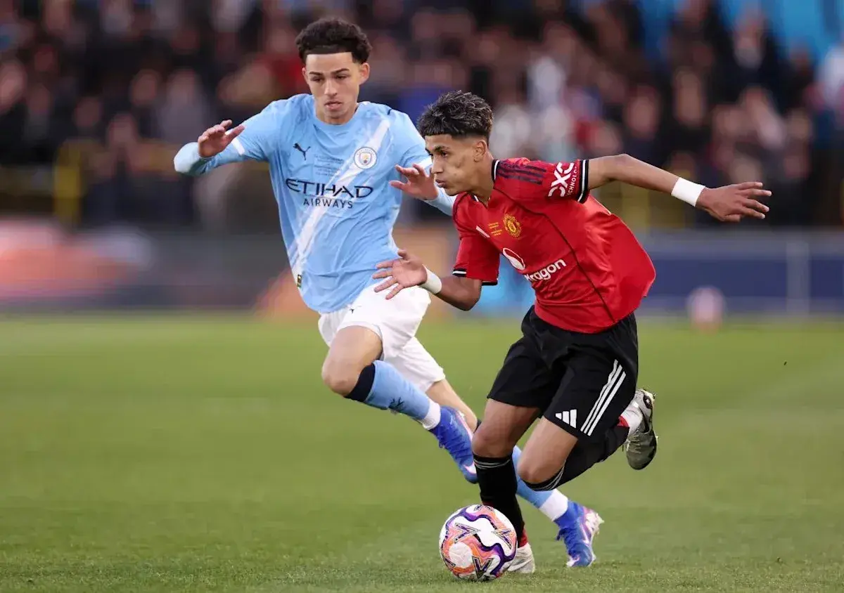 Player dribbling the ball past opponent during match Player dribbling the ball past opponent during match