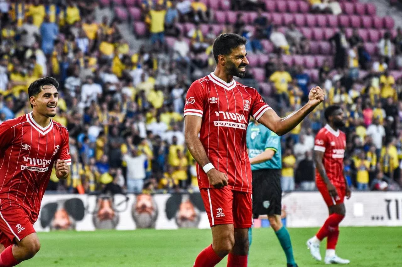 Hapoel Beer Sheva players celebrating a goal Hapoel Beer Sheva players celebrating a goal