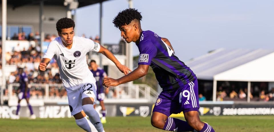 Two players competing during New England II vs Orlando City II Two players competing during New England II vs Orlando City II