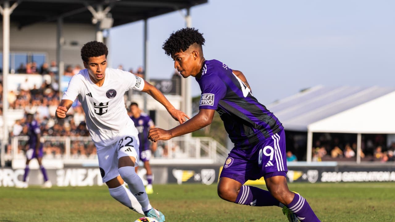 Two players competing during New England II vs Orlando City II Two players competing during New England II vs Orlando City II