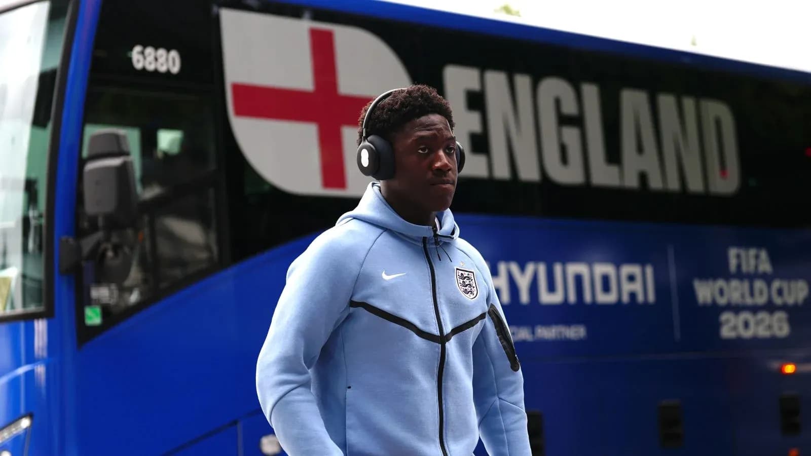 Player walking near England team bus before match Player walking near England team bus before match