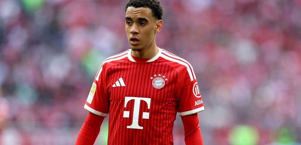 Player wearing Bayern Munich jersey on the field Player wearing Bayern Munich jersey on the field