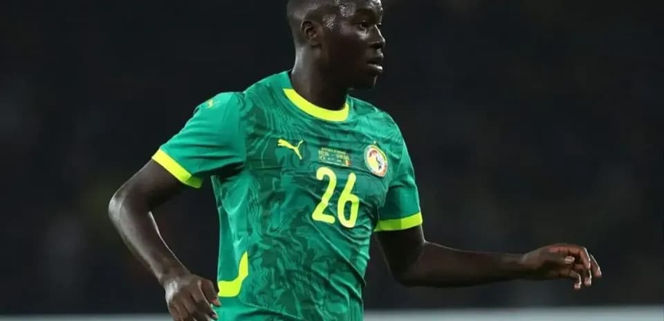 Senegal player in green jersey during match Senegal player in green jersey during match