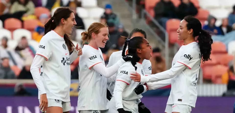 Players celebrating a goal during NWSL match Players celebrating a goal during NWSL match