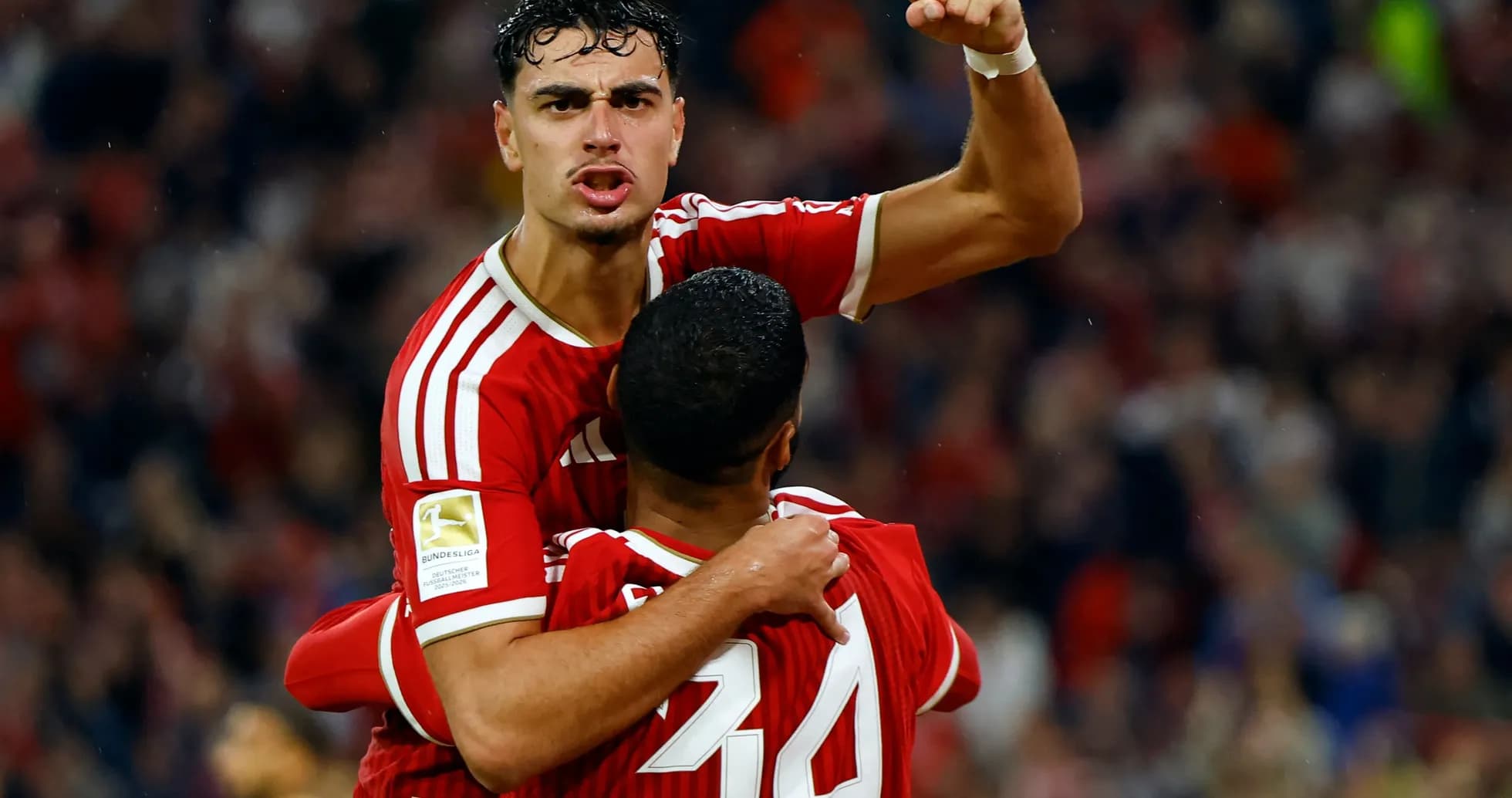 Player celebrating with teammate after scoring goal Player celebrating with teammate after scoring goal