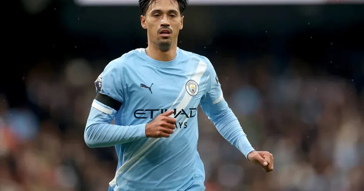 Player running during a Manchester City match Player running during a Manchester City match