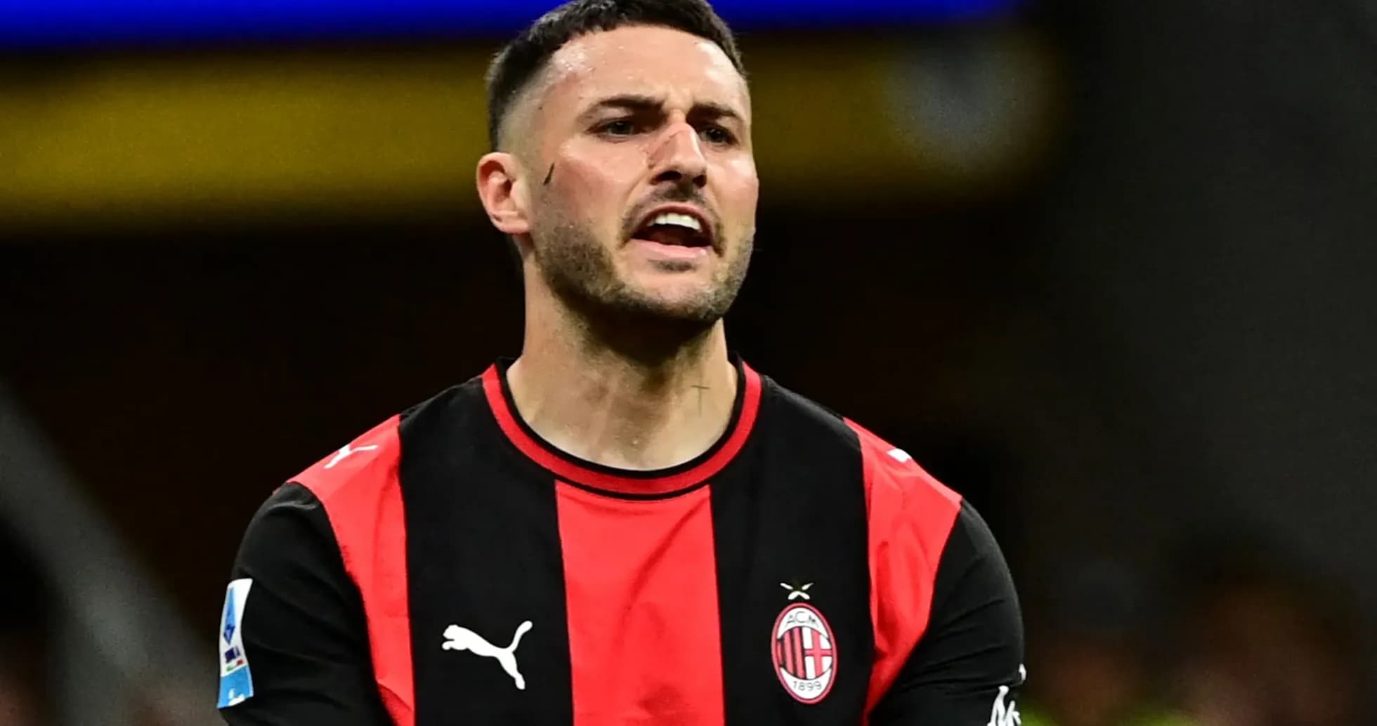 Player in AC Milan jersey reacting on the field Player in AC Milan jersey reacting on the field