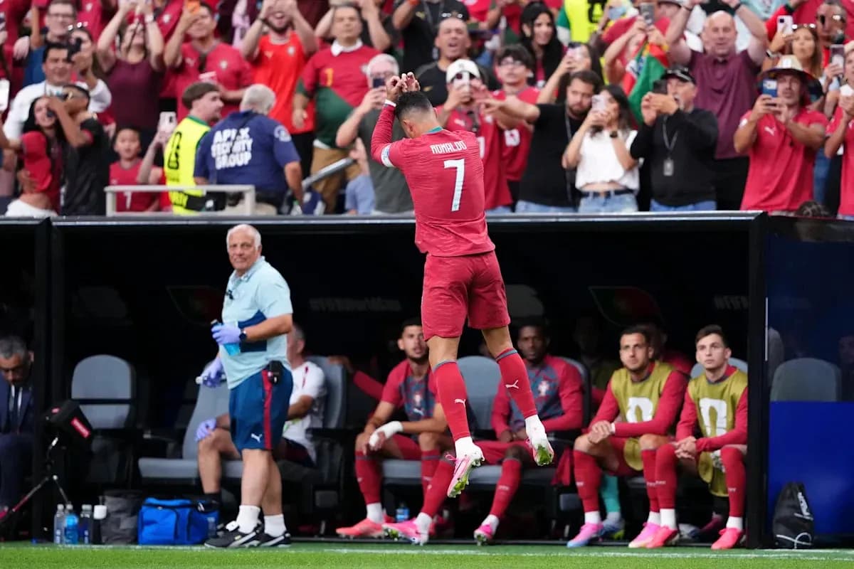 Player celebrating in front of cheering fans Player celebrating in front of cheering fans