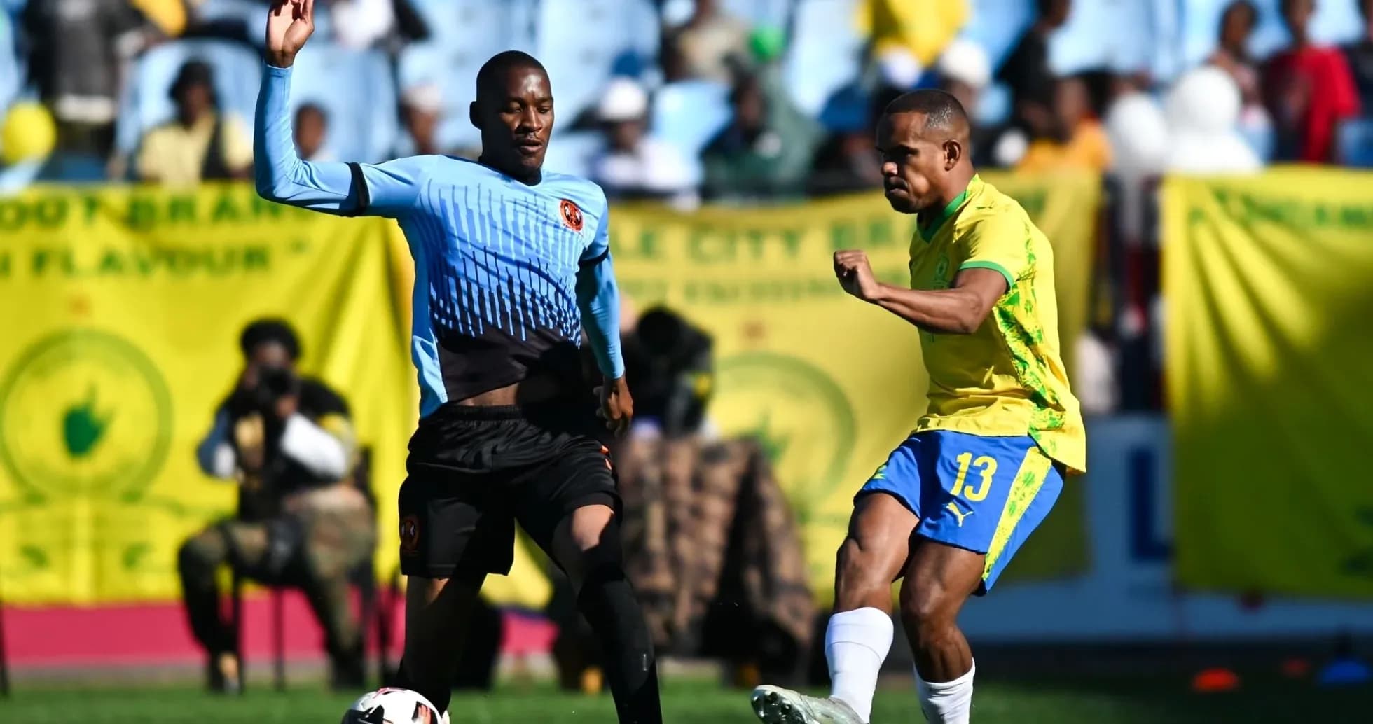 Player kicking the ball during a soccer match Player kicking the ball during a soccer match