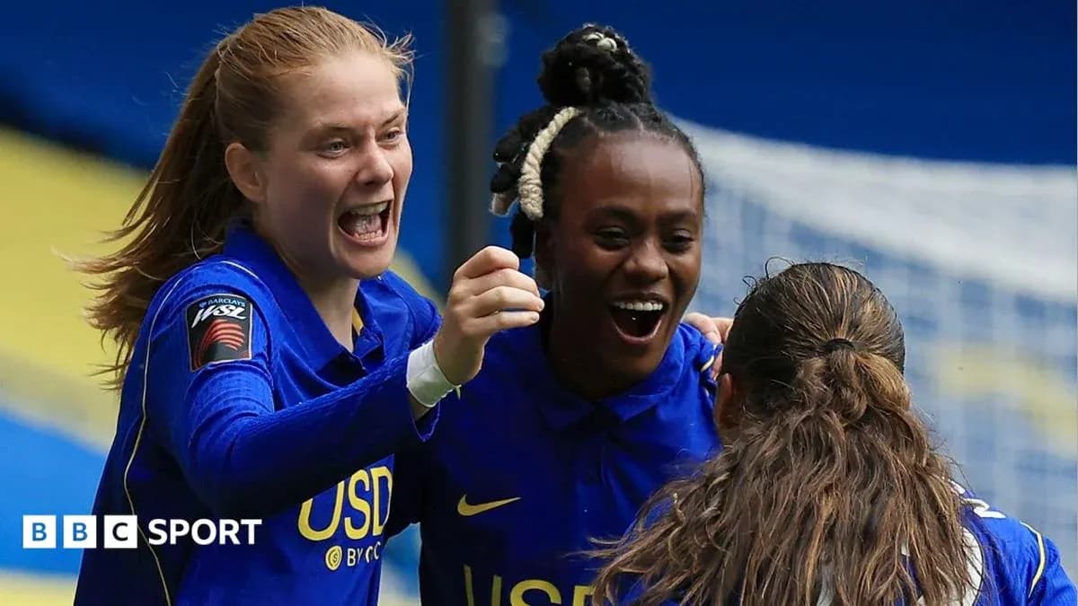 Players celebrating a goal during a match Players celebrating a goal during a match
