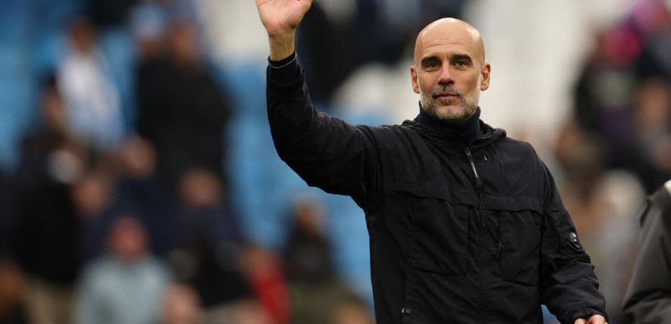 Manager waving to fans during match day Manager waving to fans during match day