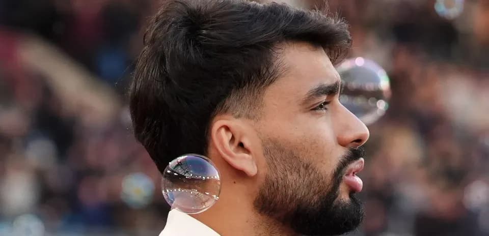 Player with bubbles near his ear during match Player with bubbles near his ear during match