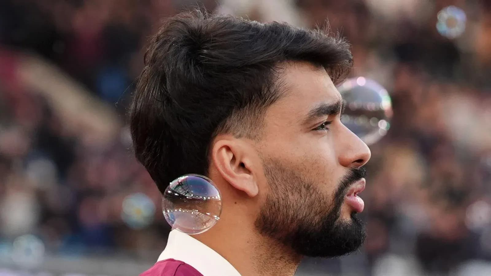 Player with bubbles near his ear during match Player with bubbles near his ear during match