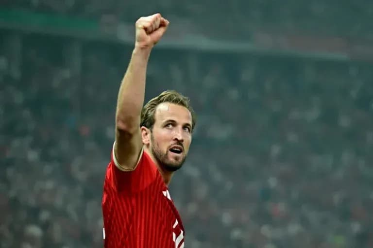 Player celebrating with raised fist during match Player celebrating with raised fist during match