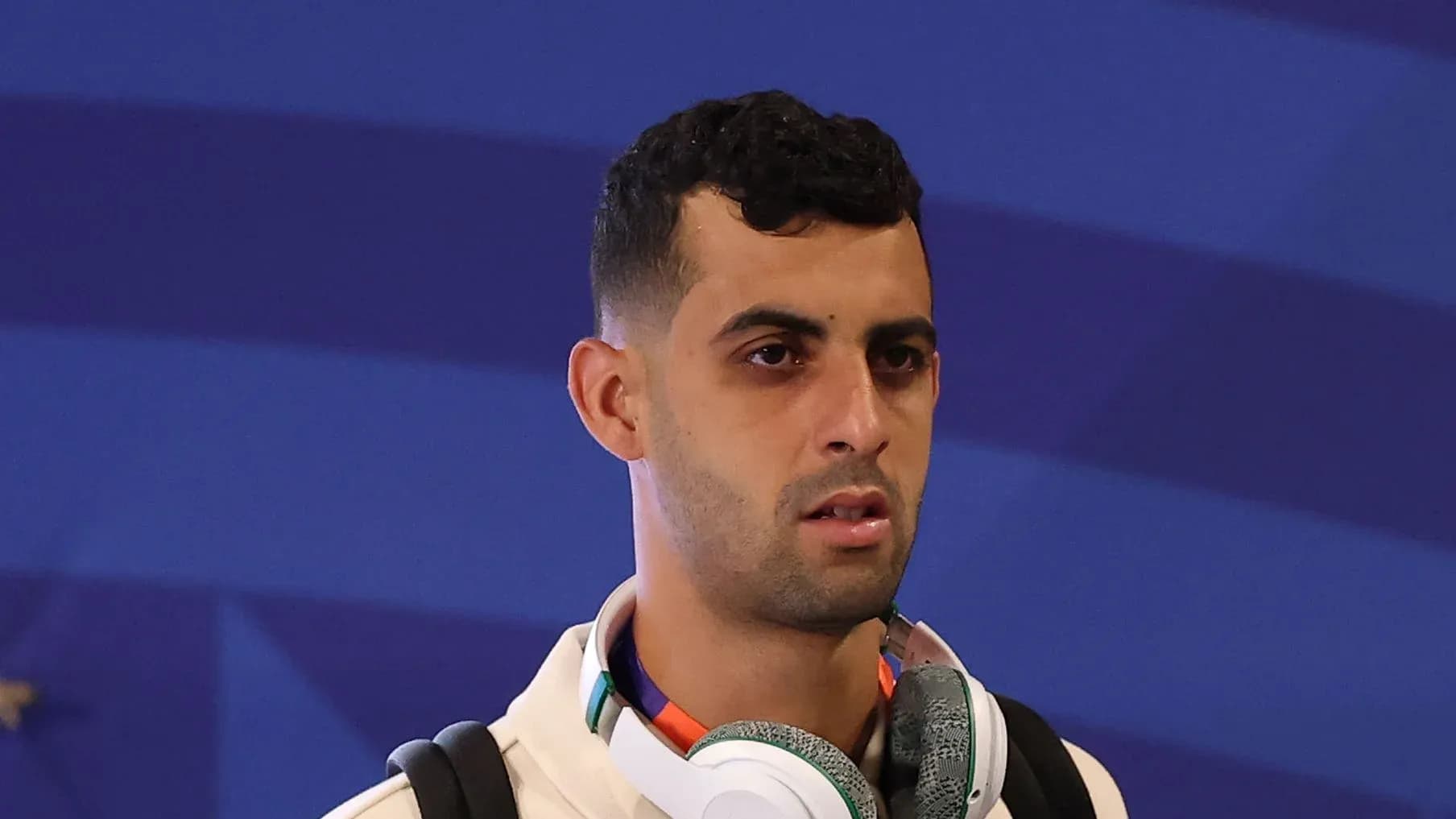Player wearing headphones during event arrival Player wearing headphones during event arrival
