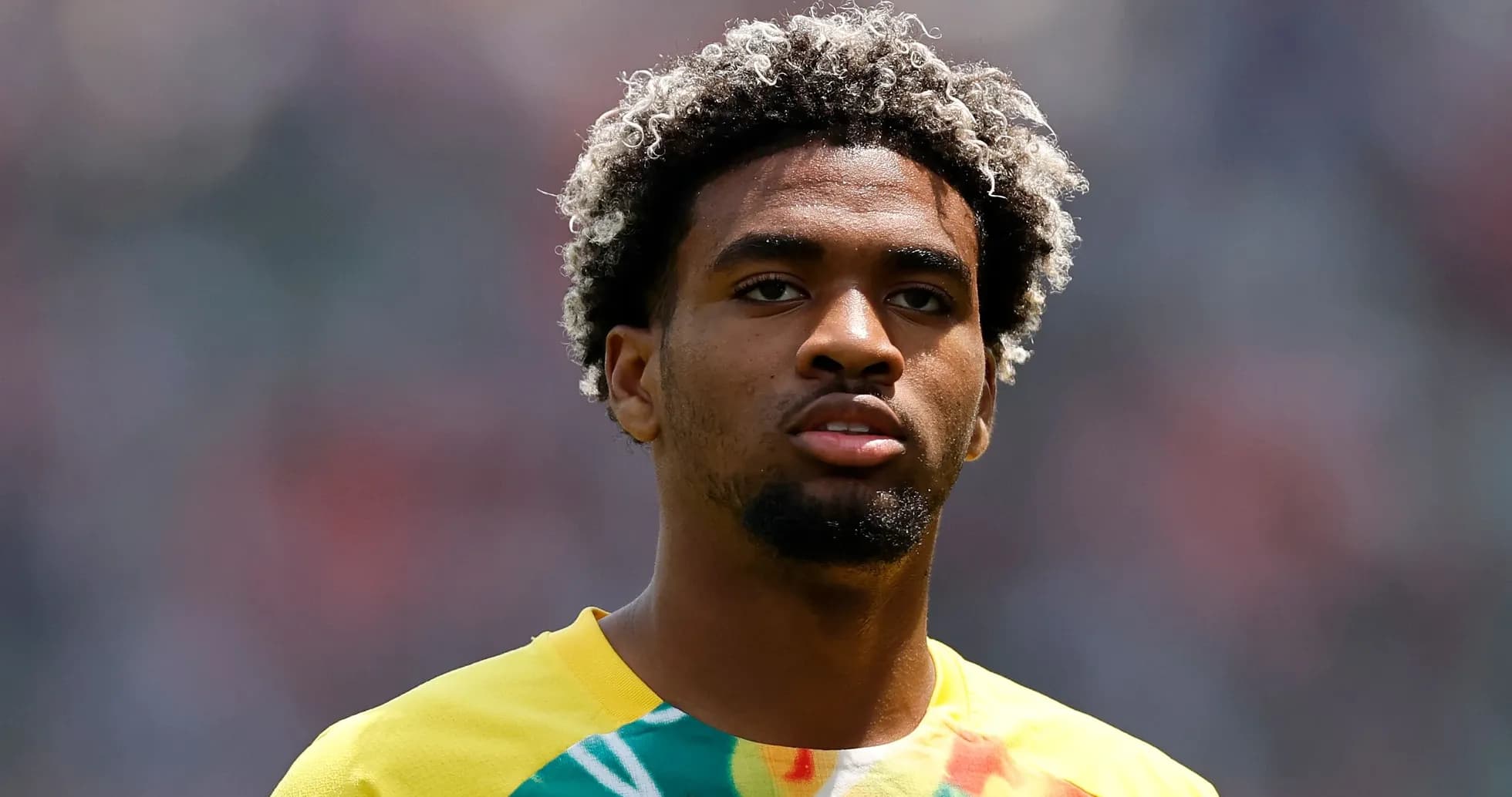 Player in yellow jersey during warm-up before match Player in yellow jersey during warm-up before match