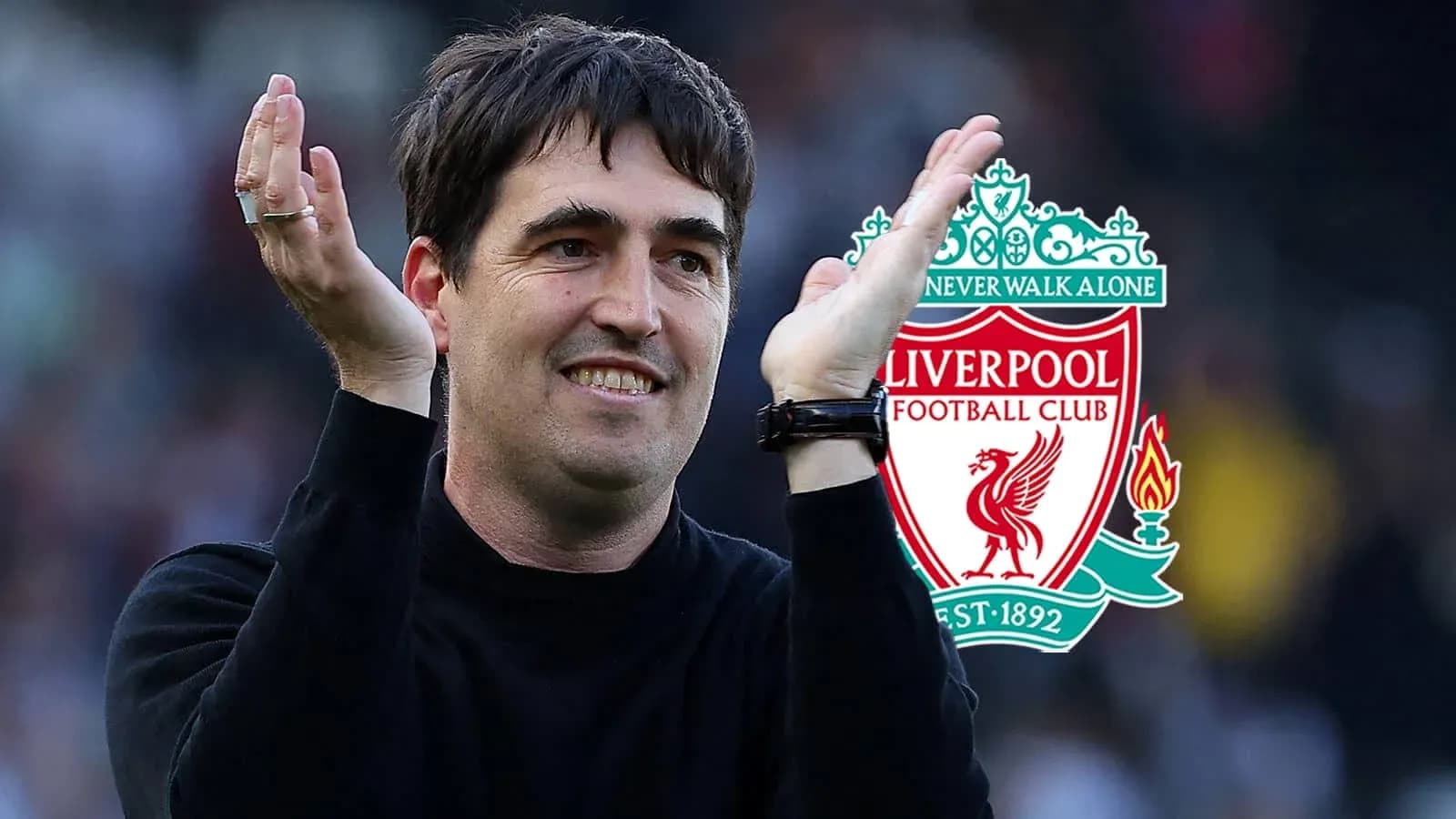 Coach celebrating with Liverpool FC logo in background Coach celebrating with Liverpool FC logo in background