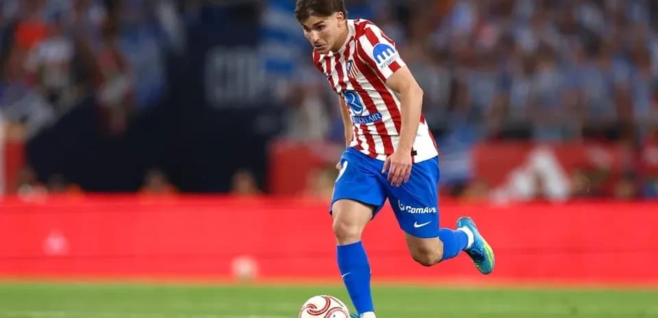 Player dribbling the ball during a match Player dribbling the ball during a match