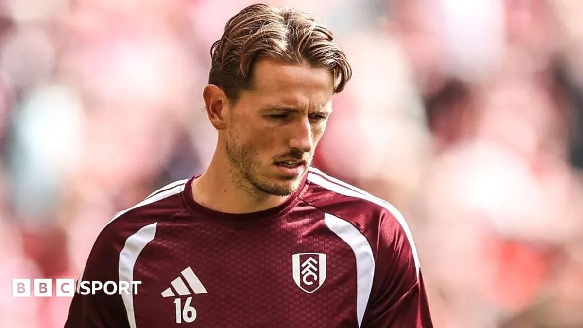 Player in Fulham kit warming up before match Player in Fulham kit warming up before match