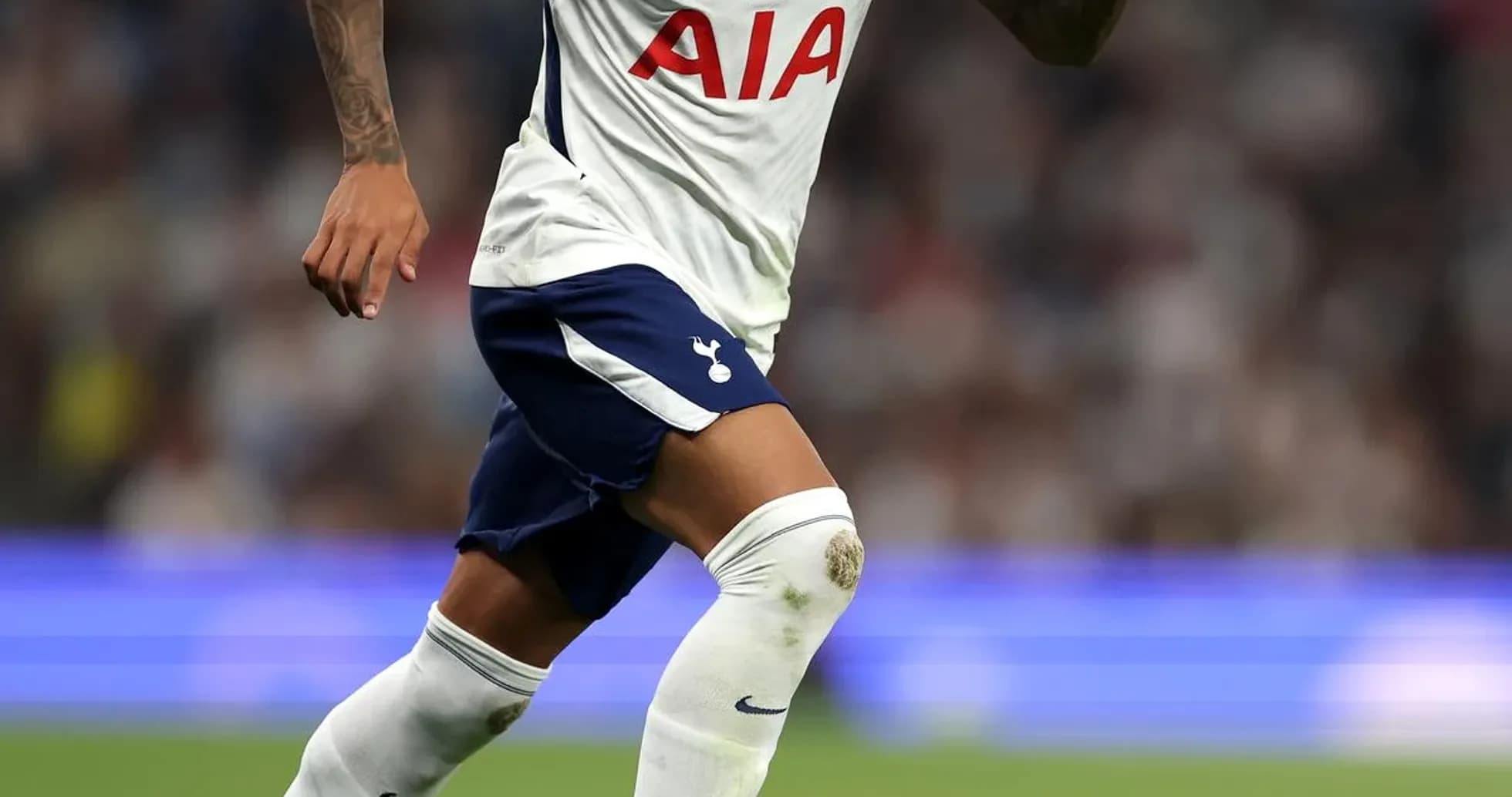 Player dribbling the ball during a match Player dribbling the ball during a match