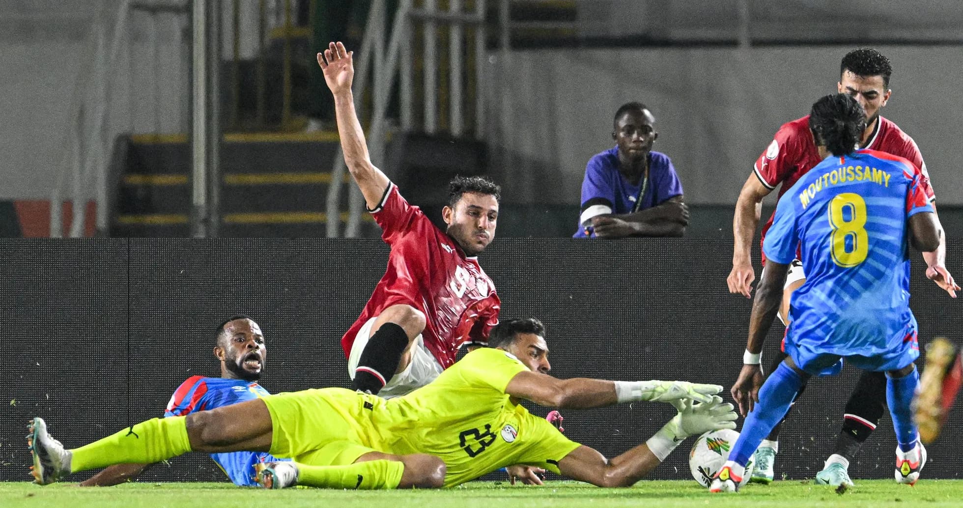 Players contesting a loose ball near the goal Players contesting a loose ball near the goal