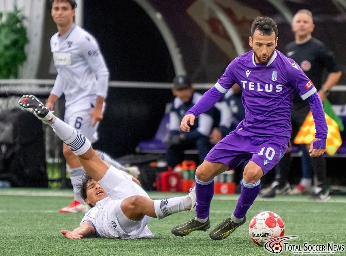 Player tackling opponent during Vancouver FC match Player tackling opponent during Vancouver FC match