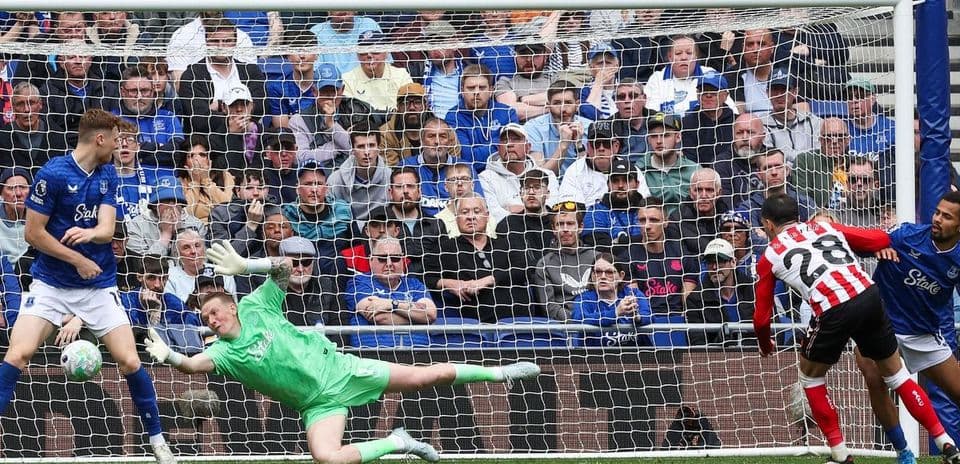 Goalkeeper saving a shot during Everton match Goalkeeper saving a shot during Everton match
