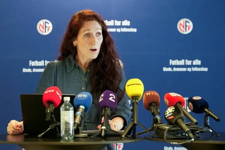 Woman speaking at press conference with microphones Woman speaking at press conference with microphones