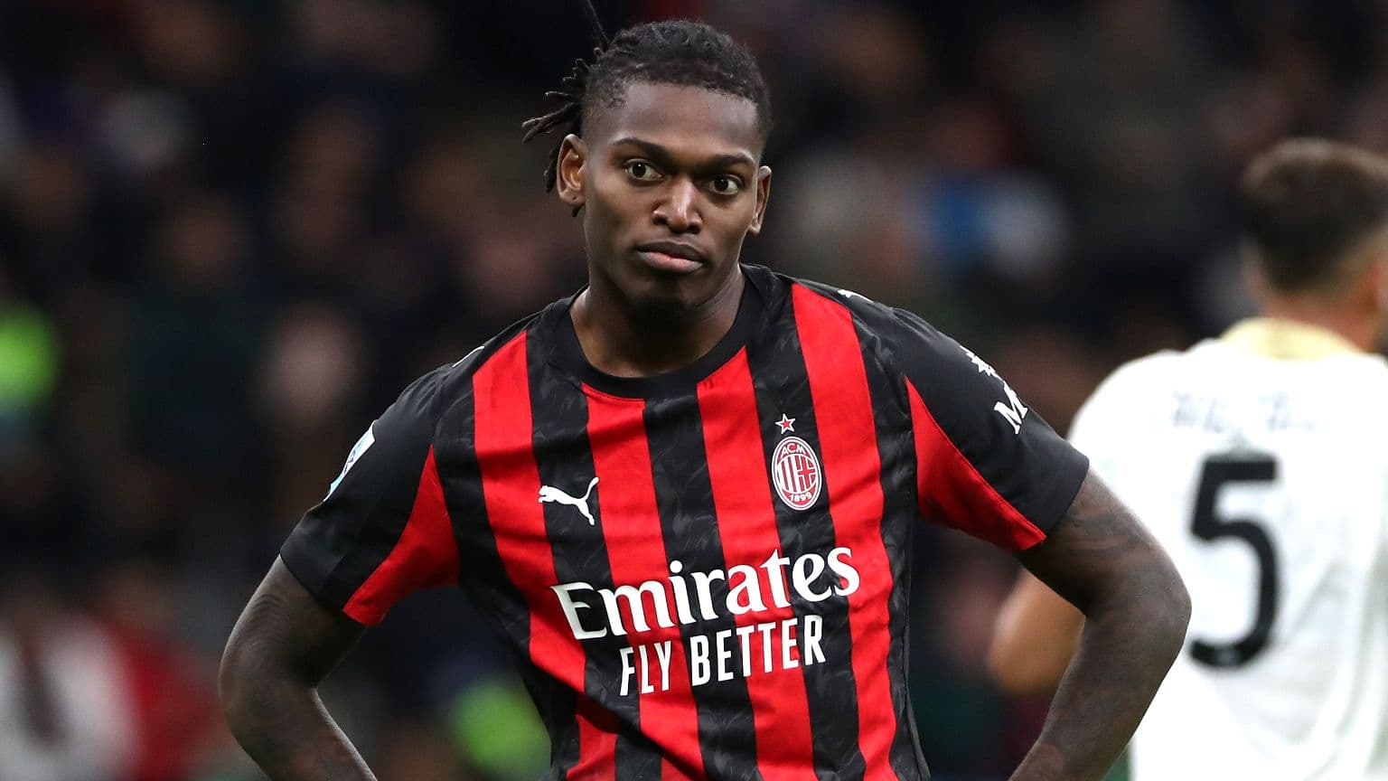 AC Milan player during match with focused expression AC Milan player during match with focused expression