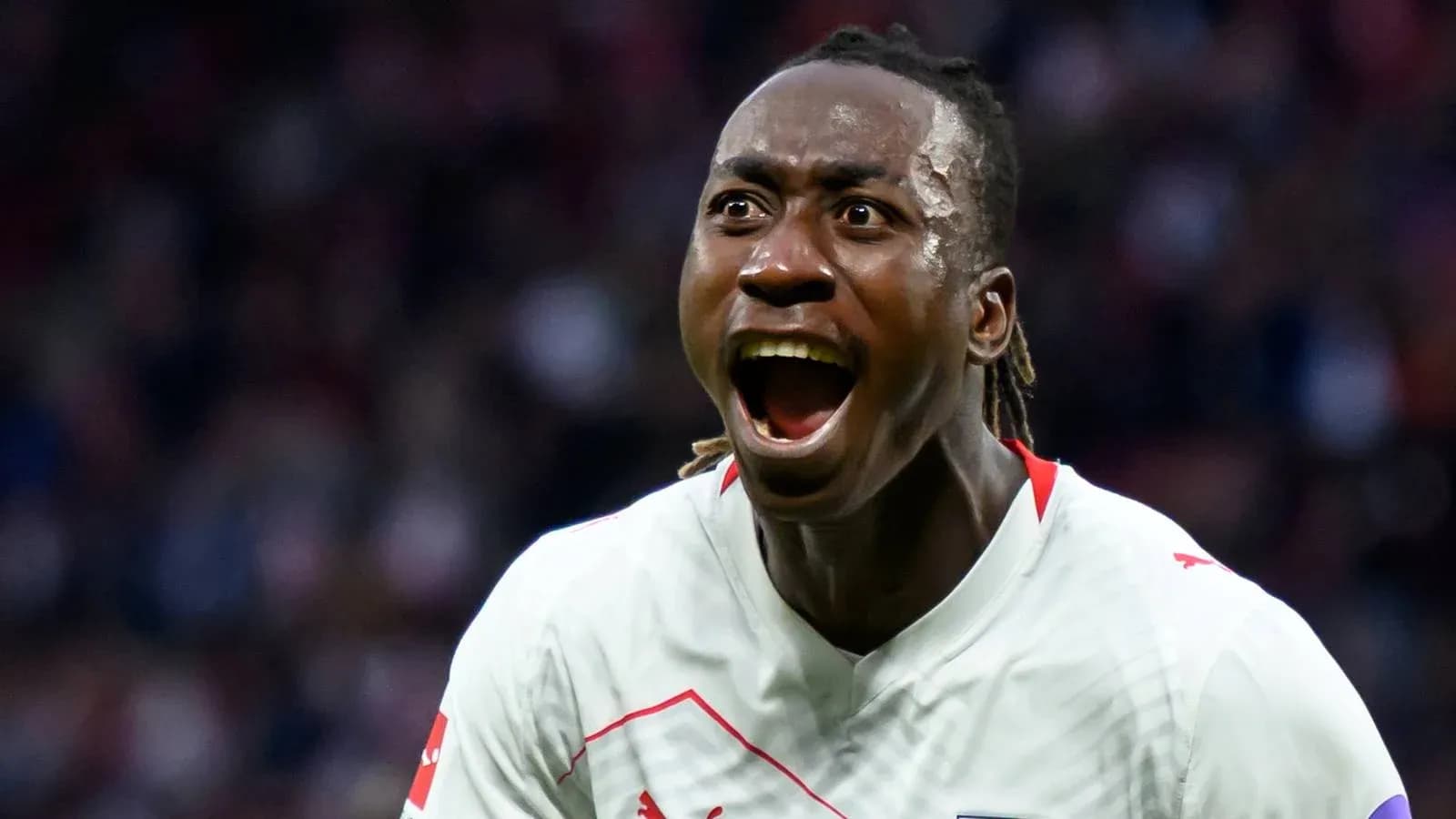 Player celebrating passionately during a match Player celebrating passionately during a match