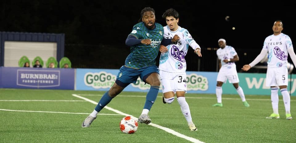 Player dribbling the ball during Pacific FC match Player dribbling the ball during Pacific FC match