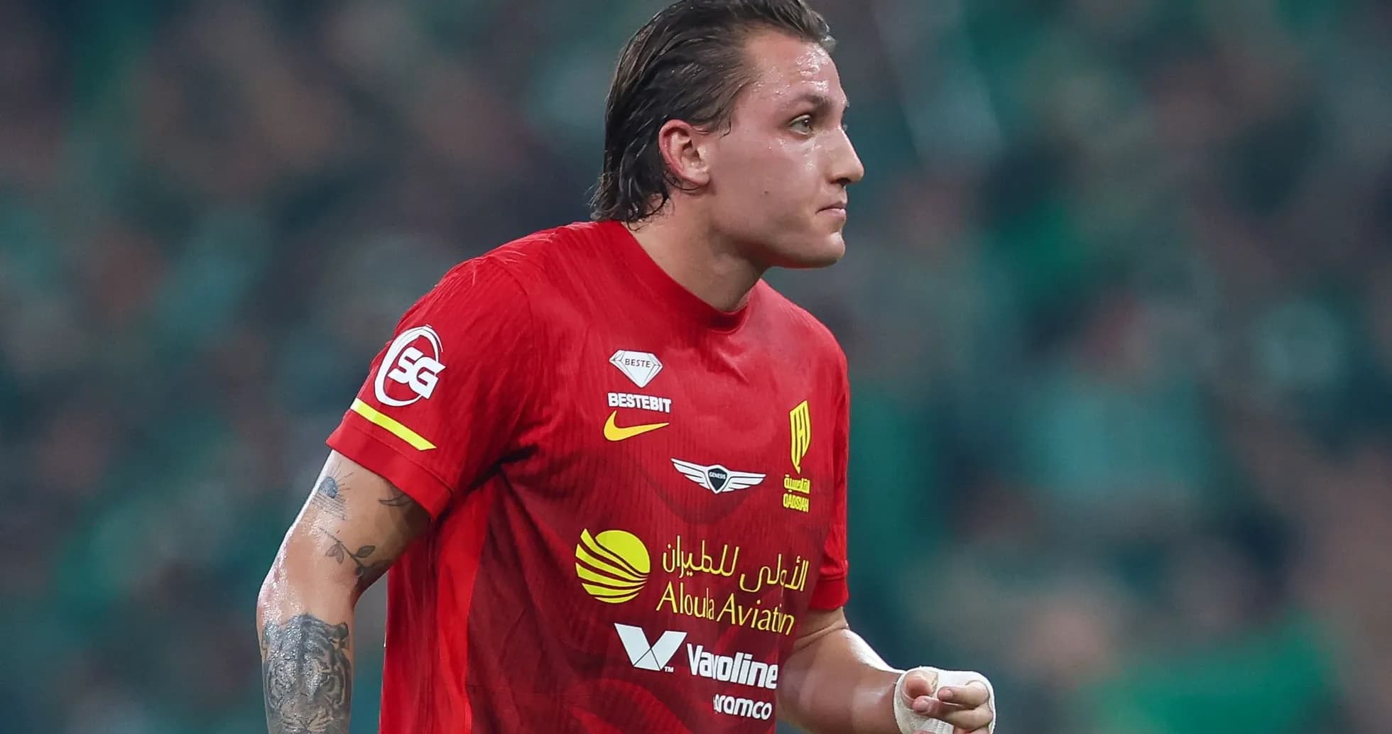 Player wearing red jersey during a match Player wearing red jersey during a match