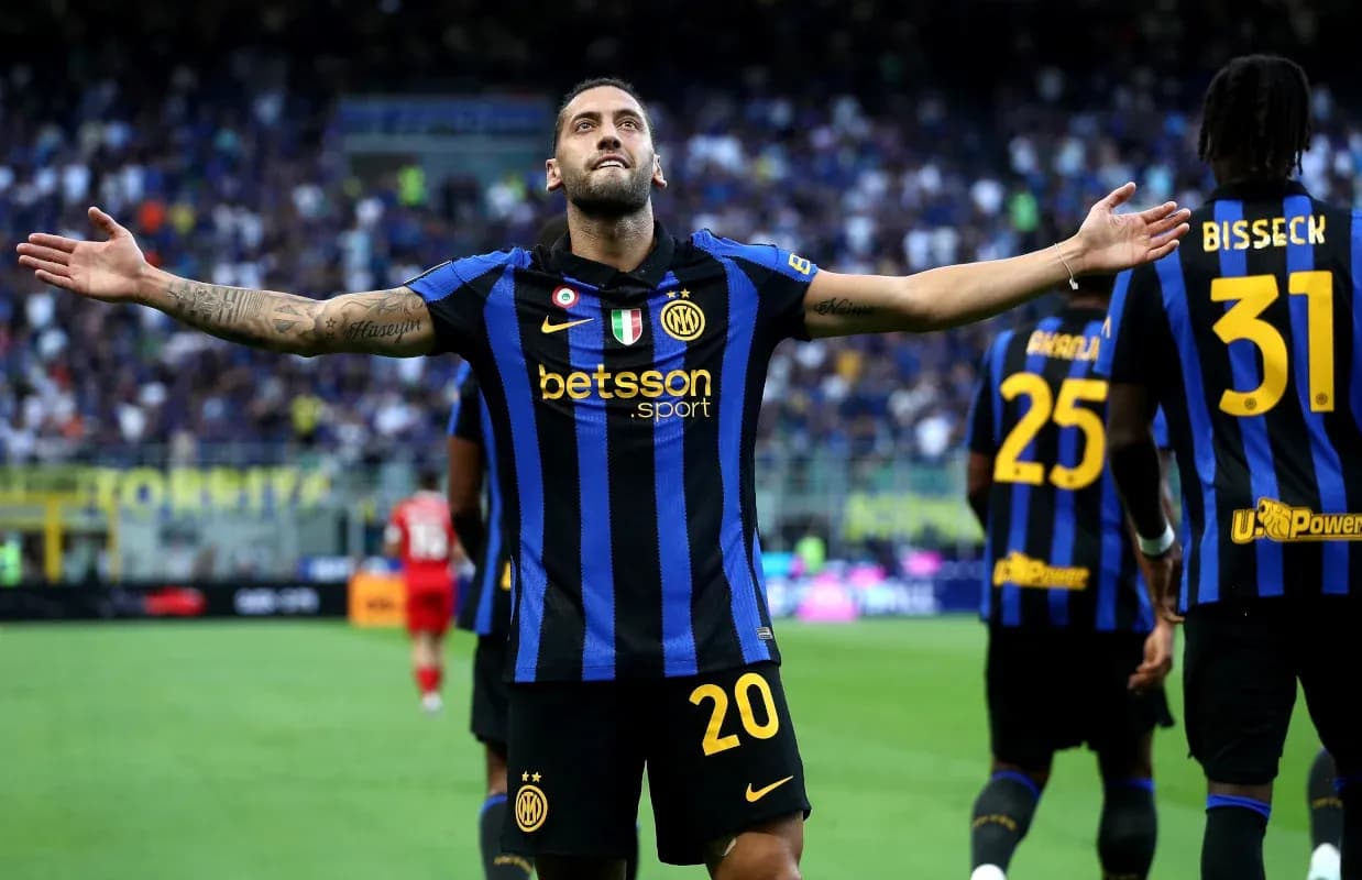 Player celebrating a goal with teammates at stadium Player celebrating a goal with teammates at stadium