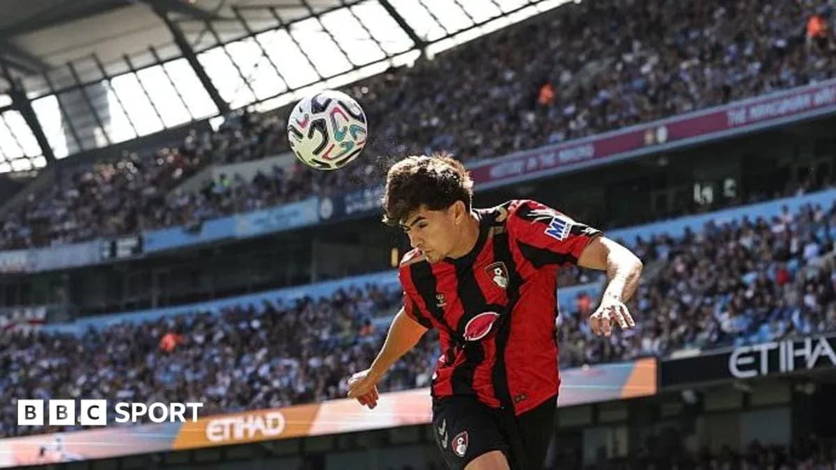 Player heading the ball during match at Etihad Stadium Player heading the ball during match at Etihad Stadium