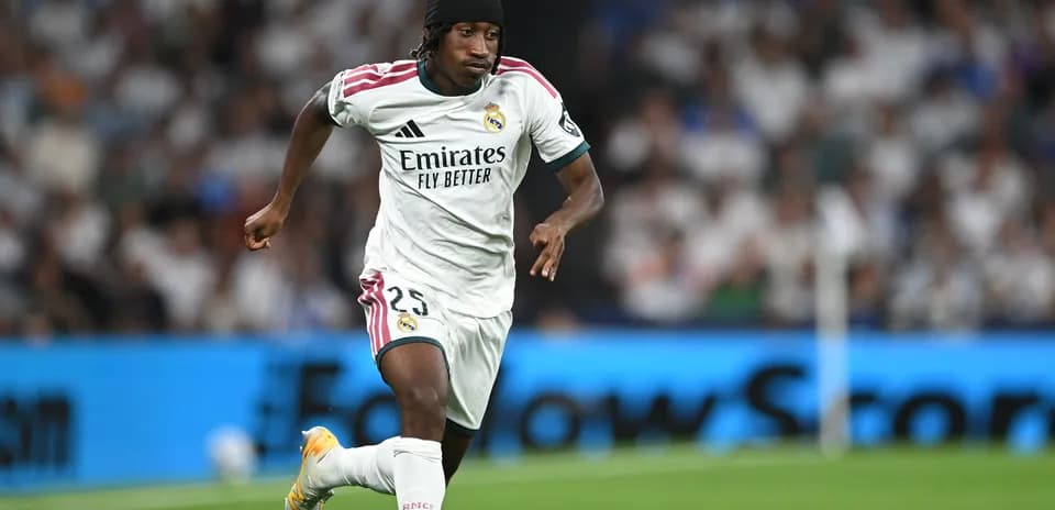 Player running with ball during Real Madrid match Player running with ball during Real Madrid match